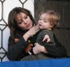 Knox Jolie Pitt drops his doll bunny off his the balcony while with his mother Angelina Jolie on April 9th 2010 in Venice Italy 5