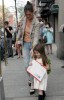 Suri Cruise walks with mom Katie Holmes while carrying a large US Postage envelope on April 8th 2010 in New York City 2