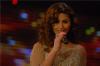 Singer Mai Selime sings on stage at the TV musical show The Stage AL Haflah in April 2010 wearing a shiny beige dress 1