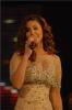 Singer Mai Selime sings on stage at the TV musical show The Stage AL Haflah in April 2010 wearing a shiny beige dress 4