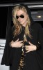 KeSha spotted on June 3rd 2010 as she leaves the central London Hotel accompanied by bodyguards 5