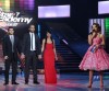 pictrure of the Star Academy 7 prime 16th finale while Hilda Khalife the show presenter on stage with three nominees Rahma and Nassif and Mohamed Ramadan