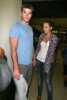 Miley Cyrus seen with her boyfriend Liam Hemsworth on june 16th 2010 as they arrive at LAX airport 6