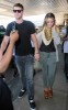 Miley Cyrus picture with her boyfriend Liam Hemsworth on June 18th 2010 while arriving at LaGuardia Airport in New York 2