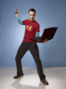 poster quality photo of actor Sheldon Cooper played by actor Jim Parsons in The Big Bang Theory comedy series with his laptop