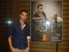 Mohammad Rafe from Jordan standing beside a concert poster of himself