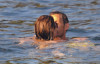 Carla Bruni seen with her husband the French President Nicolas Sarkozy on August 9th 2009 in the south of France while swimming in the beach 1