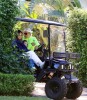 Thalia picture with husband Tommy Mottola and daughter Sabrina Sakaa in a Golf car  on April 5th 2010 in Miami Florida 2