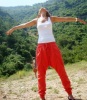 Newset photo of Nina Abdl Malak wearing red pants and a white top in June 2011 at a city in Lebanon after leaving star academy 9