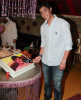 photo of the Kuwaiti student of star academy Abdul Salam after leaving star academy cutting a celebration cake