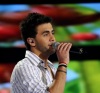 the 15th prime of staracademy8 on July 8th 2011 picture of Ahmad Ezzat singing onstage